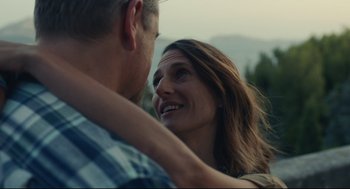 Movie still from “Stillwater” (2021), directed by Tom McCarthy – A man and a woman embracing each other; Close Up shot, Low angle