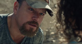 Movie still from “Stillwater” (2021), directed by Tom McCarthy – A person wearing a hat; Close Up shot, Over the shoulder angle