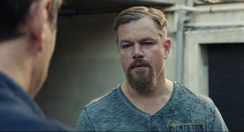 Movie still from “Stillwater” (2021), directed by Tom McCarthy – A person with a beard; Close Up shot, Over the shoulder angle