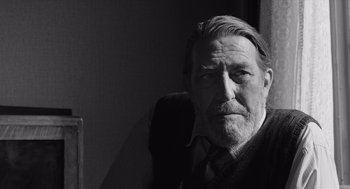 Movie still from “Belfast” (2021), directed by Kenneth Branagh – An older man with a beard and mustache; Close Up shot, Low angle