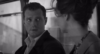 Movie still from “Belfast” (2021), directed by Kenneth Branagh – A black and white photo of a man and a woman looking at each other; Close Up shot, Over the shoulder angle