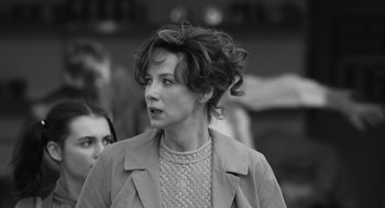 Movie still from “Belfast” (2021), directed by Kenneth Branagh – Black and white photograph of a woman in a jacket; Close Up shot, Over the shoulder angle