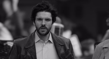 Movie still from “Belfast” (2021), directed by Kenneth Branagh – Black and white photograph of a man in a jacket; Close Up shot, Low angle