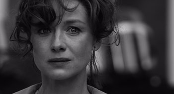 Movie still from “Belfast” (2021), directed by Kenneth Branagh – Black and white photograph of a woman's face; Close Up shot, Over the shoulder angle