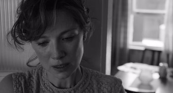 Movie still from “Belfast” (2021), directed by Kenneth Branagh – A person looking down at the ground; Close Up shot, Over the shoulder angle