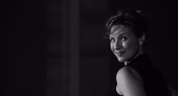 Movie still from “Belfast” (2021), directed by Kenneth Branagh – Black and white photograph of a woman smiling; Close Up shot, Low angle
