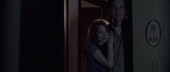 Movie still from “Take Shelter” (2011), directed by Jeff Nichols – A man and a woman posing for a picture; Medium shot, Low angle