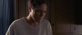 Movie still from “Take Shelter” (2011), directed by Jeff Nichols – A person with his eyes closed; Close Up shot, Low angle