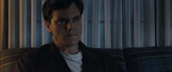 Movie still from “Take Shelter” (2011), directed by Jeff Nichols – A person sitting in a chair; Close Up shot, Low angle