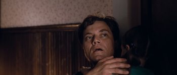 Movie still from “Take Shelter” (2011), directed by Jeff Nichols – A person with his hands on his chest; Close Up shot, Low angle