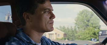 Movie still from “Take Shelter” (2011), directed by Jeff Nichols – A person in a car looking out the window; Close Up shot, Low angle