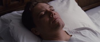 Movie still from “Take Shelter” (2011), directed by Jeff Nichols – A person laying in a bed; Close Up shot, High angle