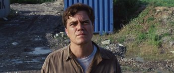 Movie still from “Take Shelter” (2011), directed by Jeff Nichols – A person wearing a brown shirt; Close Up shot, Low angle