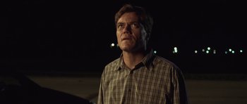 Movie still from “Take Shelter” (2011), directed by Jeff Nichols – A man standing in the dark looking up at the sky; Close Up shot, Low angle