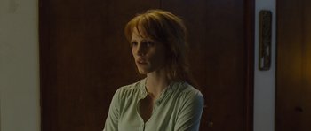 Movie still from “Take Shelter” (2011), directed by Jeff Nichols – A woman with red hair wearing a white shirt; Close Up shot, Low angle