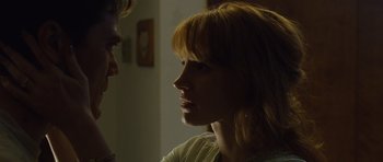 Movie still from “Take Shelter” (2011), directed by Jeff Nichols – A man and a woman looking at one another; Close Up shot, Low angle