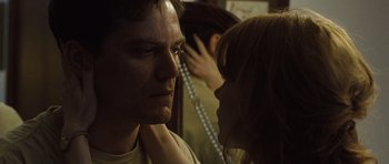 Movie still from “Take Shelter” (2011), directed by Jeff Nichols – A man and a woman looking at one another; Close Up shot, Low angle