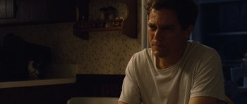 Movie still from “Take Shelter” (2011), directed by Jeff Nichols – A man sitting in front of a mirror in a room; Close Up shot, Low angle