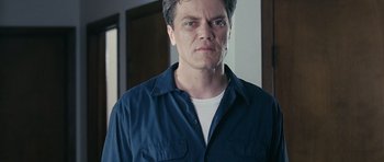 Movie still from “Take Shelter” (2011), directed by Jeff Nichols – A person wearing a blue shirt; Close Up shot, Low angle