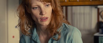 Movie still from “Take Shelter” (2011), directed by Jeff Nichols – A person with long red hair; Close Up shot, Over the shoulder angle