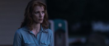 Movie still from “Take Shelter” (2011), directed by Jeff Nichols – A woman in a blue shirt is looking to her left; Close Up shot, Over the shoulder angle