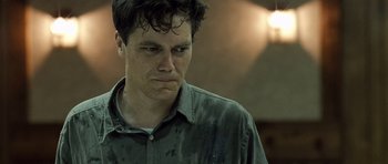 Movie still from “Take Shelter” (2011), directed by Jeff Nichols – A person wearing a shirt; Close Up shot, Low angle