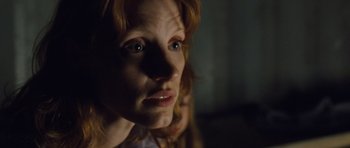 Movie still from “Take Shelter” (2011), directed by Jeff Nichols – A woman's face in the dark; Close Up shot, Low angle