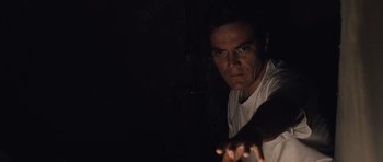 Movie still from “Take Shelter” (2011), directed by Jeff Nichols – A man in white shirt looking at the camera; Close Up shot, Low angle