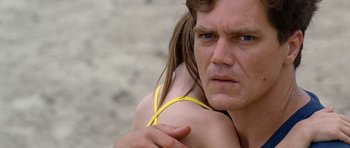 Movie still from “Take Shelter” (2011), directed by Jeff Nichols – A person with long hair on a beach; Close Up shot, Low angle