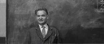 Movie still from “The 400 Blows” (1959), directed by François Truffaut – An older man wearing a suit and a tie; Close Up shot, Low angle