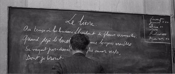 Movie still from “The 400 Blows” (1959), directed by François Truffaut – A man writing on a chalkboard in a classroom; Extreme Close Up shot, High angle