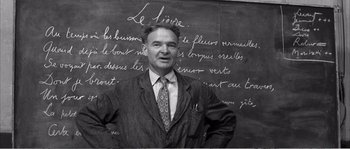 Movie still from “The 400 Blows” (1959), directed by François Truffaut – A man standing in front of a chalkboard; Close Up shot, Low angle