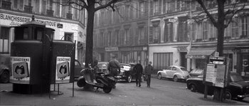 Movie still from “The 400 Blows” (1959), directed by François Truffaut – A black - and - white photo of a street scene with cars parked on the side of the road; Extreme Wide shot, High angle