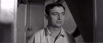 Movie still from “The 400 Blows” (1959), directed by François Truffaut – A black - and - white photo of a man looking at the camera; Close Up shot, Low angle