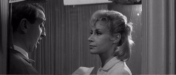 Movie still from “The 400 Blows” (1959), directed by François Truffaut – A black - and - white photo of a woman looking to her left; Close Up shot, Over the shoulder angle