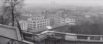 Movie still from “The 400 Blows” (1959), directed by François Truffaut – A black - and - white photo of a city skyline; Extreme Wide shot, High angle