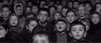 Movie still from “The 400 Blows” (1959), directed by François Truffaut – A group of young children in a crowd of people; Close Up shot, High angle