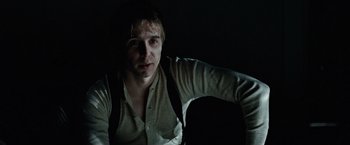 Movie still from “The Assassination of Jesse James by the Coward Robert Ford” (2007), directed by Andrew Dominik – A young man is posing for a picture; Close Up shot, Low angle