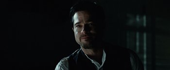 Movie still from “The Assassination of Jesse James by the Coward Robert Ford” (2007), directed by Andrew Dominik – A person wearing a vest; Close Up shot, Over the shoulder angle