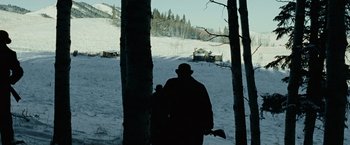 Movie still from “The Assassination of Jesse James by the Coward Robert Ford” (2007), directed by Andrew Dominik – A man standing in the middle of a snow covered field; Wide shot, Low angle