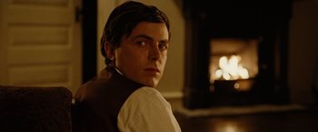 Movie still from “The Assassination of Jesse James by the Coward Robert Ford” (2007), directed by Andrew Dominik – A man in a white shirt and a brown vest; Close Up shot, Over the shoulder angle