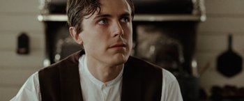 Movie still from “The Assassination of Jesse James by the Coward Robert Ford” (2007), directed by Andrew Dominik – A young man in a white shirt and a brown vest; Close Up shot, Low angle