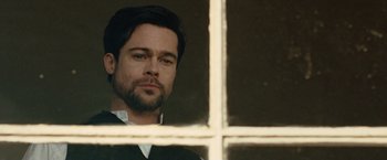 Movie still from “The Assassination of Jesse James by the Coward Robert Ford” (2007), directed by Andrew Dominik – A person looking out of a window; Close Up shot, Over the shoulder angle