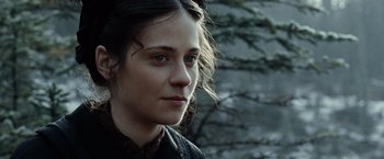 Movie still from “The Assassination of Jesse James by the Coward Robert Ford” (2007), directed by Andrew Dominik – A person wearing a jacket; Close Up shot, Over the shoulder angle