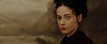 Movie still from “The Assassination of Jesse James by the Coward Robert Ford” (2007), directed by Andrew Dominik – A person wearing a dress; Close Up shot, Over the shoulder angle