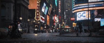 Movie still from “The Batman” (2022), directed by Matt Reeves – A city street with a lot of lights lit up at night; Extreme Wide shot, High angle