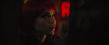 Movie still from “The Batman” (2022), directed by Matt Reeves – A person with red hair; Close Up shot, Over the shoulder angle
