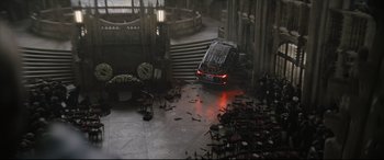 Movie still from “The Batman” (2022), directed by Matt Reeves – A car that is sitting in the middle of the street; Extreme Wide shot, High angle