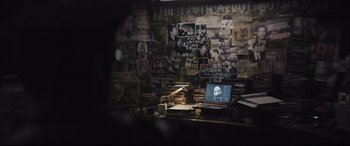 Movie still from “The Batman” (2022), directed by Matt Reeves – A room filled with lots of papers on the wall; Medium shot, High angle