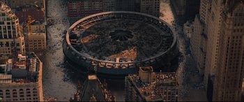 Movie still from “The Batman” (2022), directed by Matt Reeves – An aerial view of a city with buildings and water; Extreme Wide shot, Overhead angle